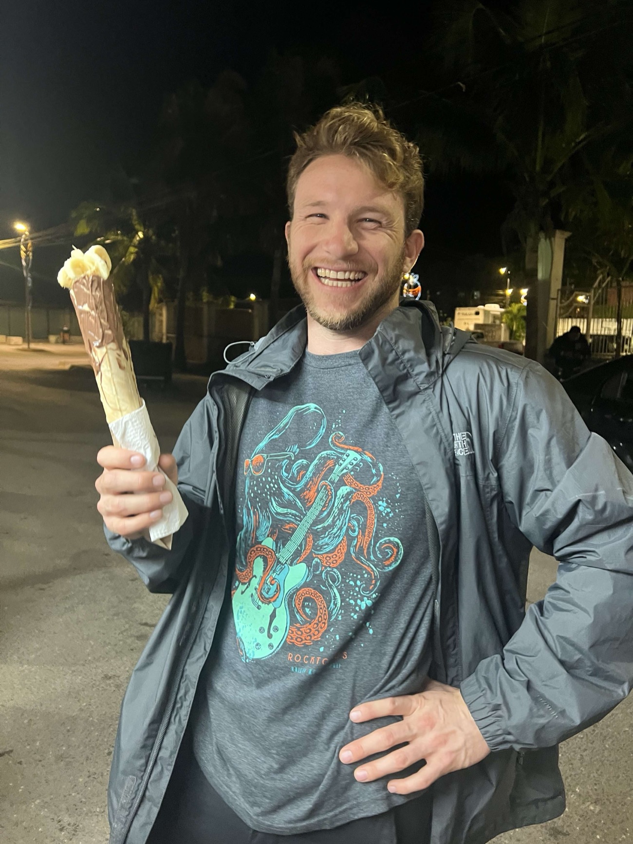 Guest smiling with a marquesita, a rolled Yucatecan street dessert in Tulum