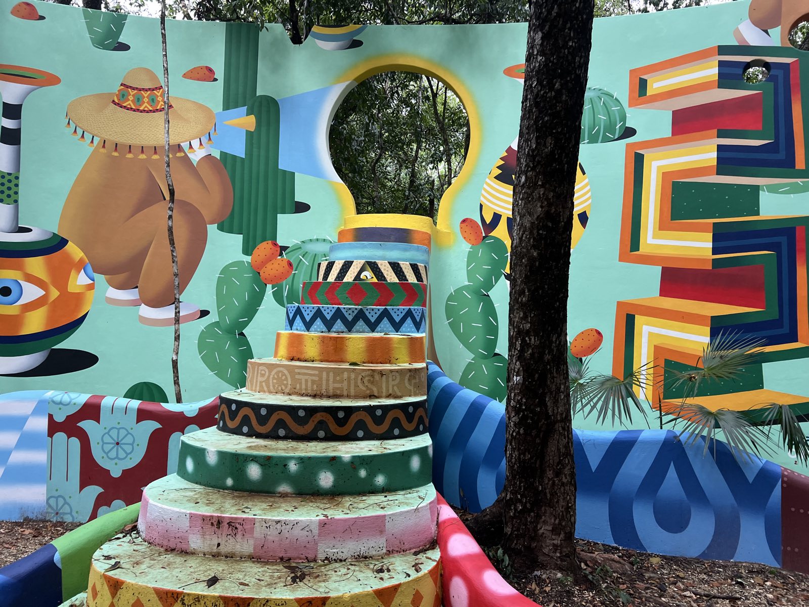 Colorful street art mural in Tulum town