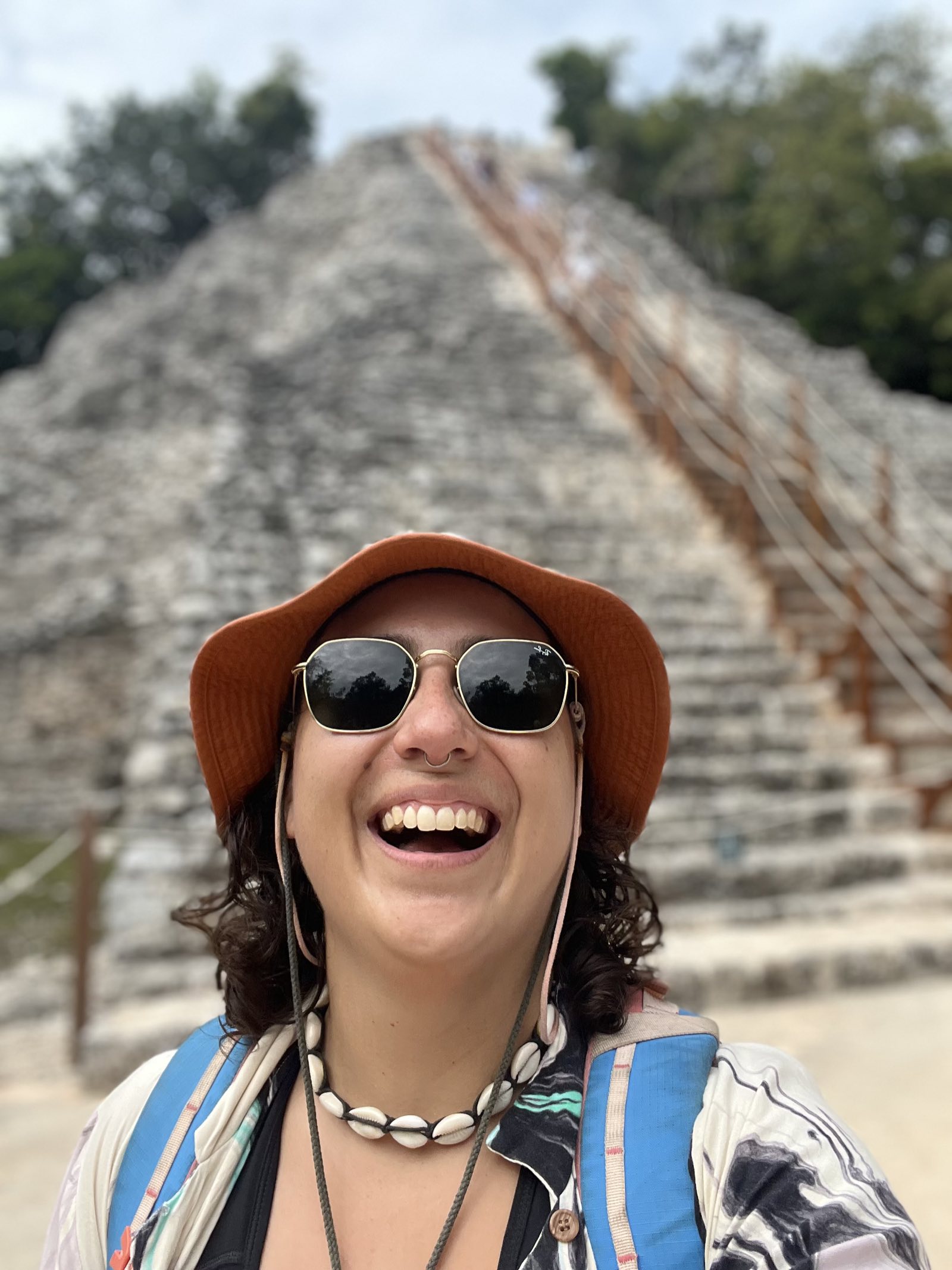 Camp Adventure Collective guide laughing at the Coba ruins near Tulum